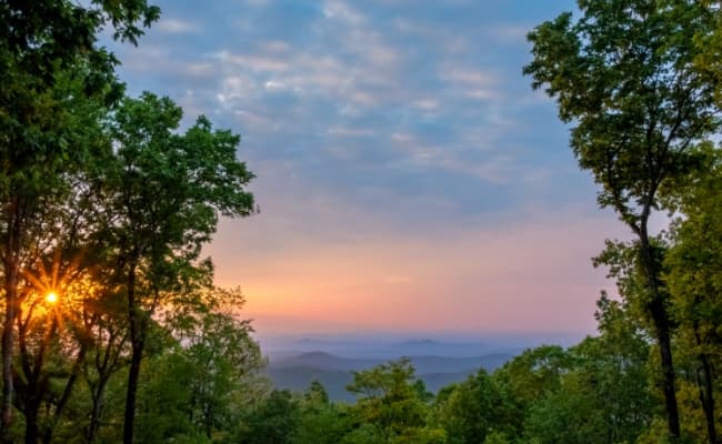 The sun rising over the mountains in Georgia.