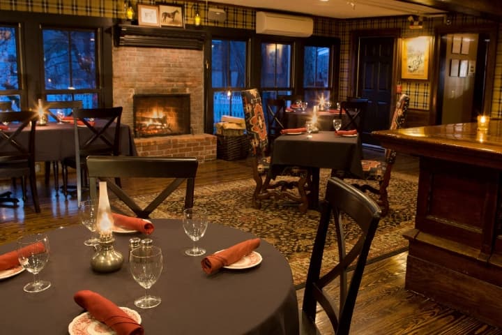 Dorset Tavern with set tables and fireplace