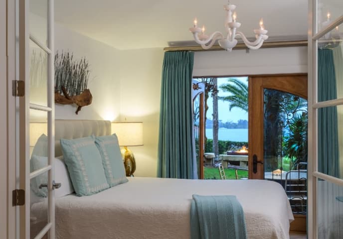 bedroom with view of water