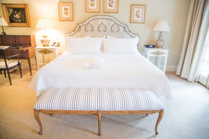 guestroom bed with with linens