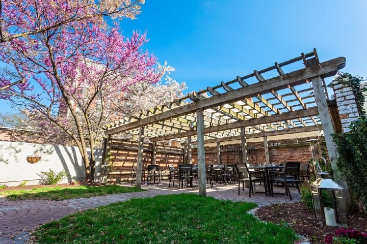 The Pergola Covered Patio for Outdoor Dining and Weddings