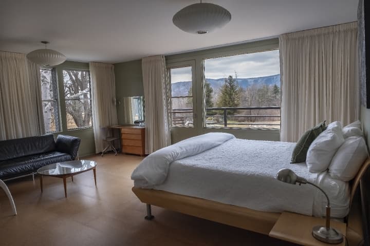 Greylock guest room with white bedding and views of the mountains