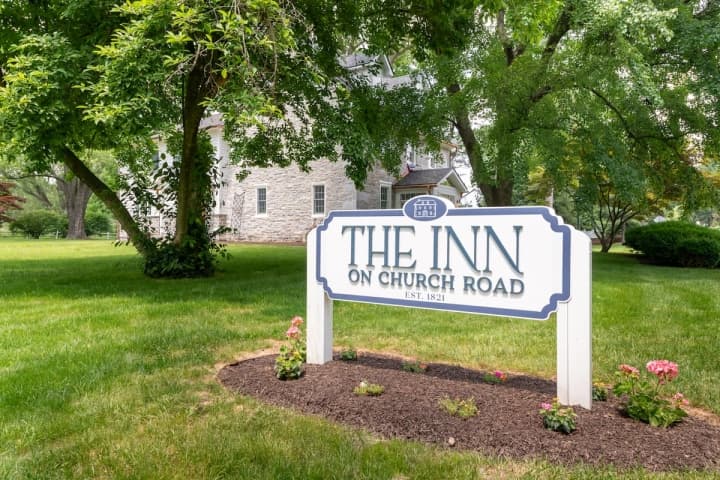 A sign for The Inn on Church Road