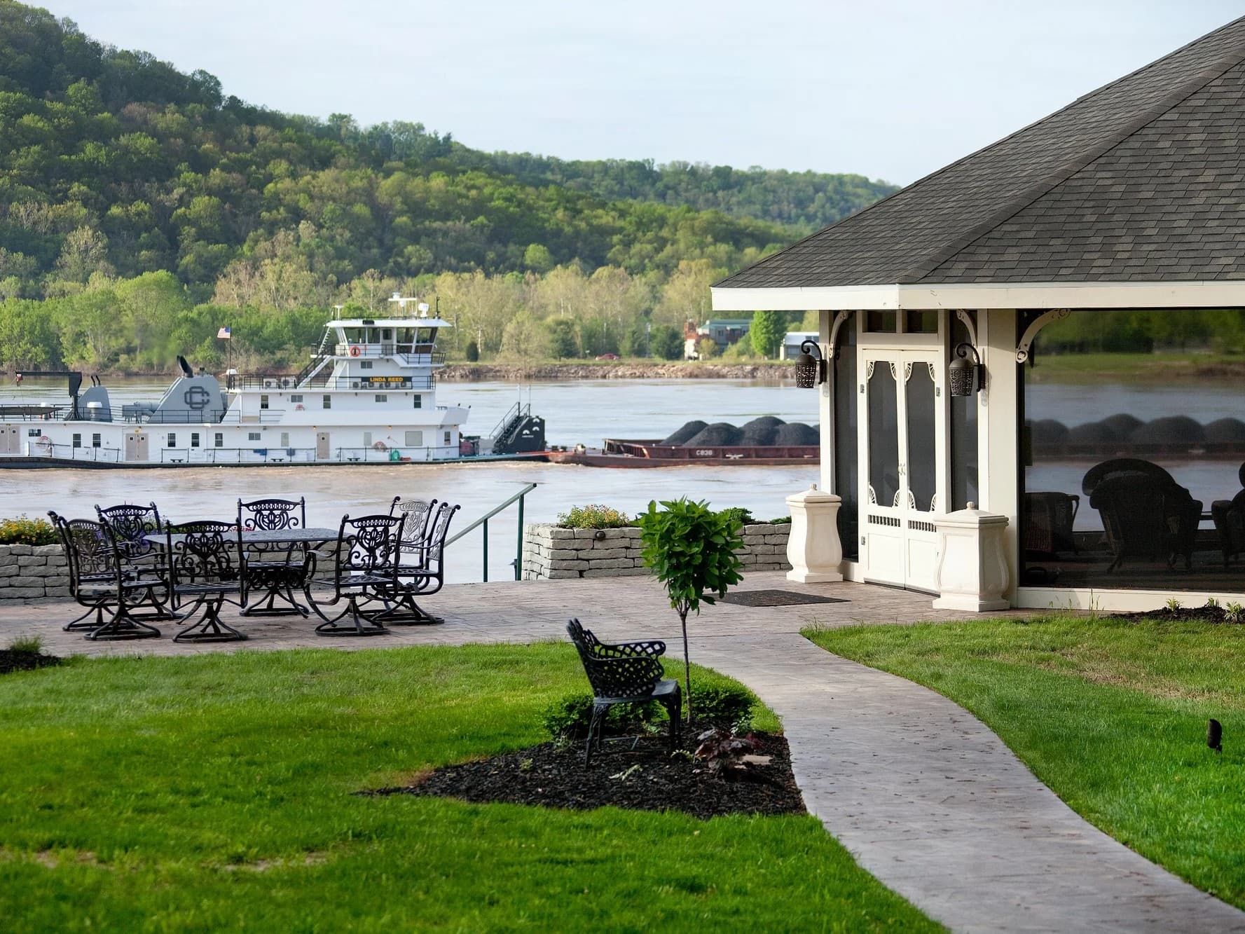 view of riverside patio and gazibo