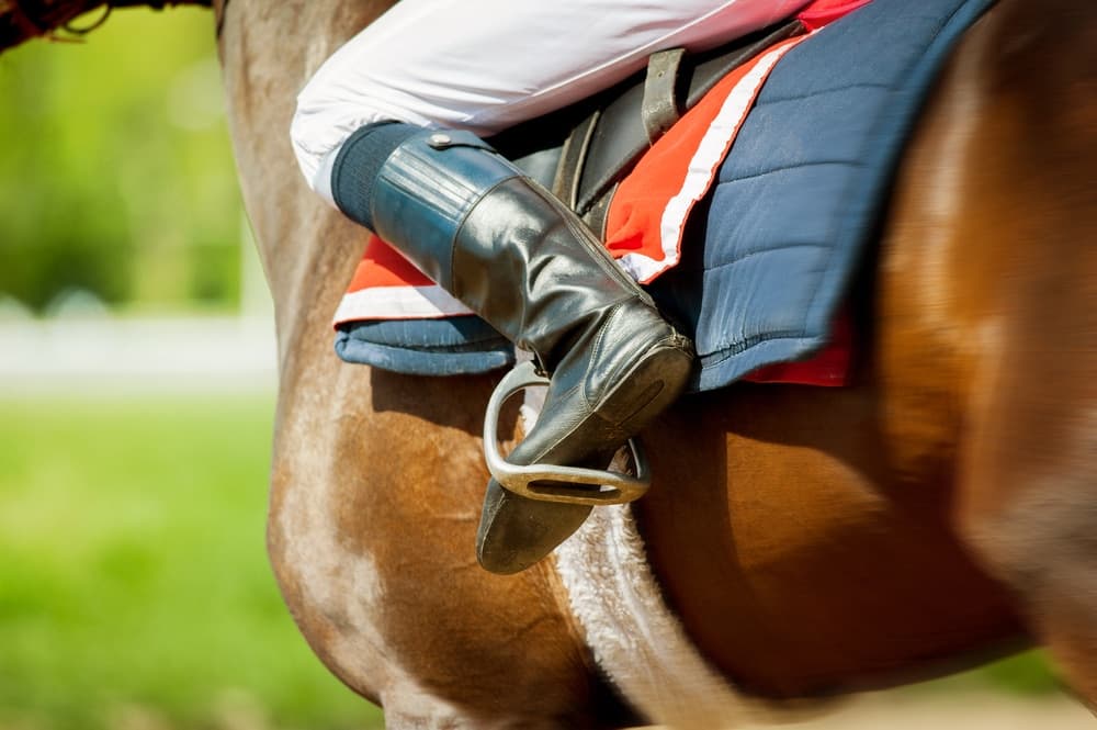 A person riding a horse - which is one of the top things to do in Saratoga Springs